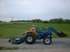 Sandy getting ready to mow our property.  When we first moved out in the trailer, she kept mowing bigger and bigger portions with a push mower, so using a tractor was a treat.  She did lots of yard work, and all of the garden work.
